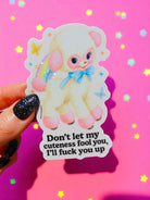 Sticker of a cute plush toy with text on a pink background