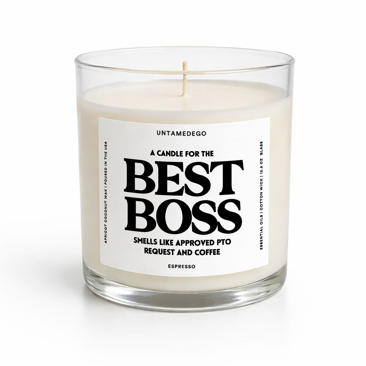 A clear glass jar candle with cream-colored wax and a white label reading 'BEST BOSS' in bold black text, photographed on a clean white background.
