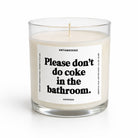 A clear glass jar candle with cream-colored wax and a white label featuring bold black text that reads, 'Please don't do coke in the bathroom.' The brand name 'UNTAMEDEGO' is visible at the top of the label.