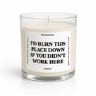 A clear glass jar candle with cream-colored wax and a white label featuring bold black text that reads, 'I'D BURN THIS PLACE DOWN IF YOU DIDN'T WORK HERE.' The brand name 'UNTAMEDEGO' is visible at the top of the label, with 'FEADER FIR' at the bottom.
