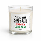 A clear glass jar candle with white wax and a single wick, featuring a white label with the text 'UNTAMEDEGO' and 'DECK THE HALLS AND NOT YOUR FAMILY fa la la la' in black, red, and green lettering, on a clean white background.