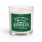 A white wax candle in a clear glass jar with a green and white label that reads 'Jolliest Bunch of Assholes This Side of the Malthouse' and 'Untamedego'.