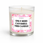 A clear glass jar candle with white wax and a humorous pink Christmas-themed label that reads 'ONLY HOES CAN SMELL THIS CANDLE' in bold black text. The candle is photographed on a clean white background with a soft shadow.