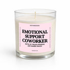 A clear glass jar candle with cream-colored wax and a light pink label that reads 'EMOTIONAL SUPPORT COWORKER' in bold black text. The brand name 'UNTAMEDEGO' is visible at the top of the label, and the scent is identified as 'Pumpkin Spice' at the bottom.