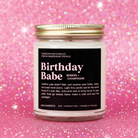 Candle labeled 'Birthday Babe' on a pink glittery background
