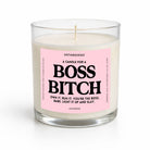 A clear glass jar candle with white wax and a pink front label reading 'UNTAMEDEGO A CANDLE FOR A BOSS BITCH' in black text, photographed on a clean white background.