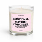 A clear glass jar candle with cream-colored wax and a light pink label that reads 'EMOTIONAL SUPPORT COWORKER' in bold black text. The candle is photographed on a clean white background with a soft shadow underneath.
