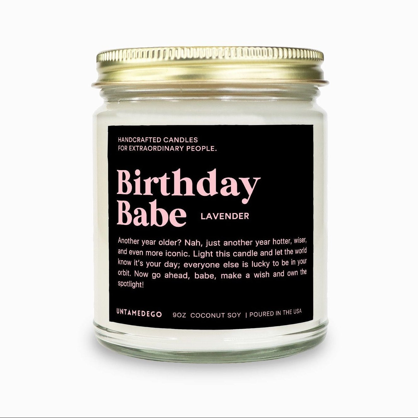 Candle jar labeled 'Birthday Babe' with gold lid on a white background