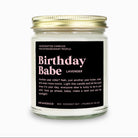 Candle jar labeled 'Birthday Babe' with gold lid on a white background