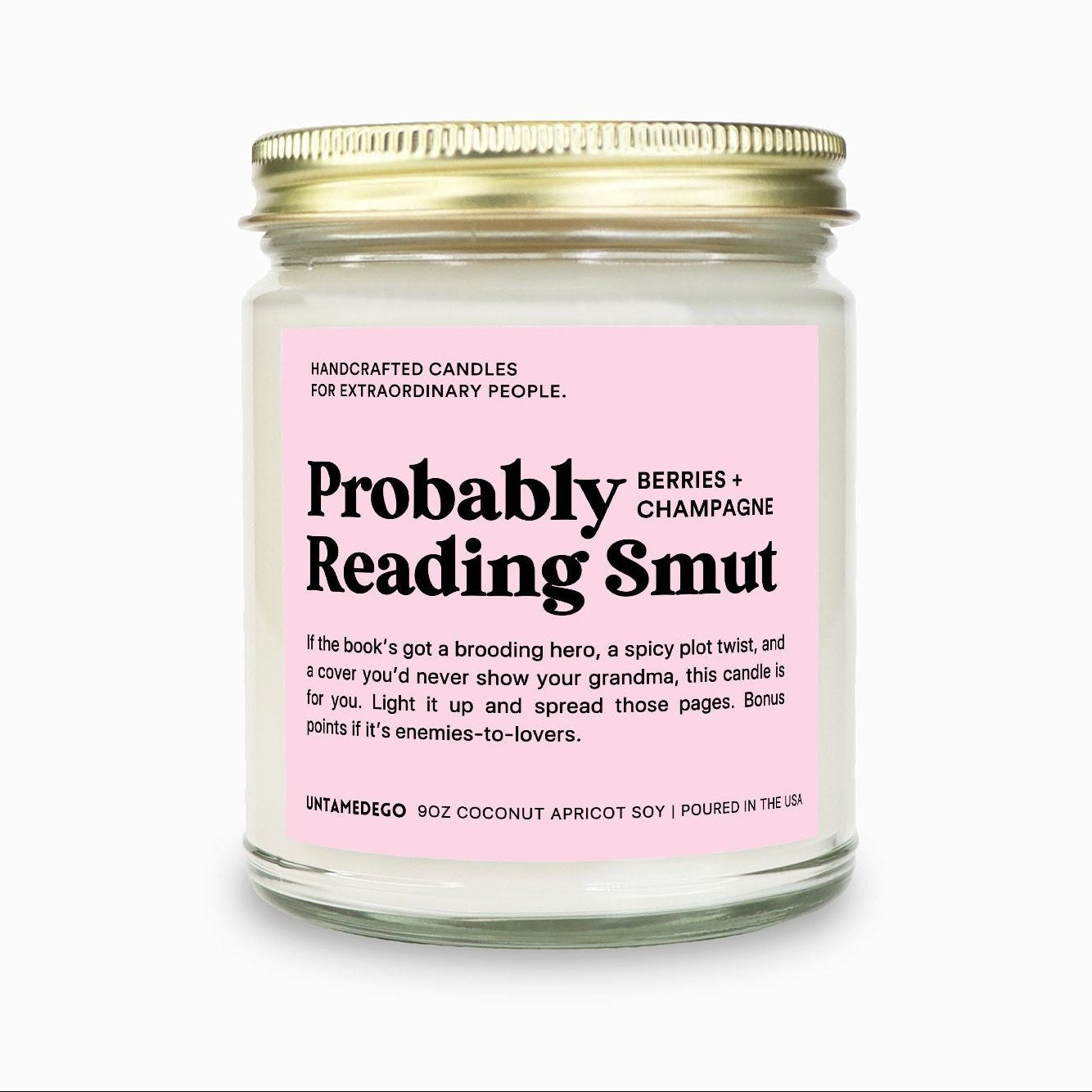 Candle with a pink label on a white background