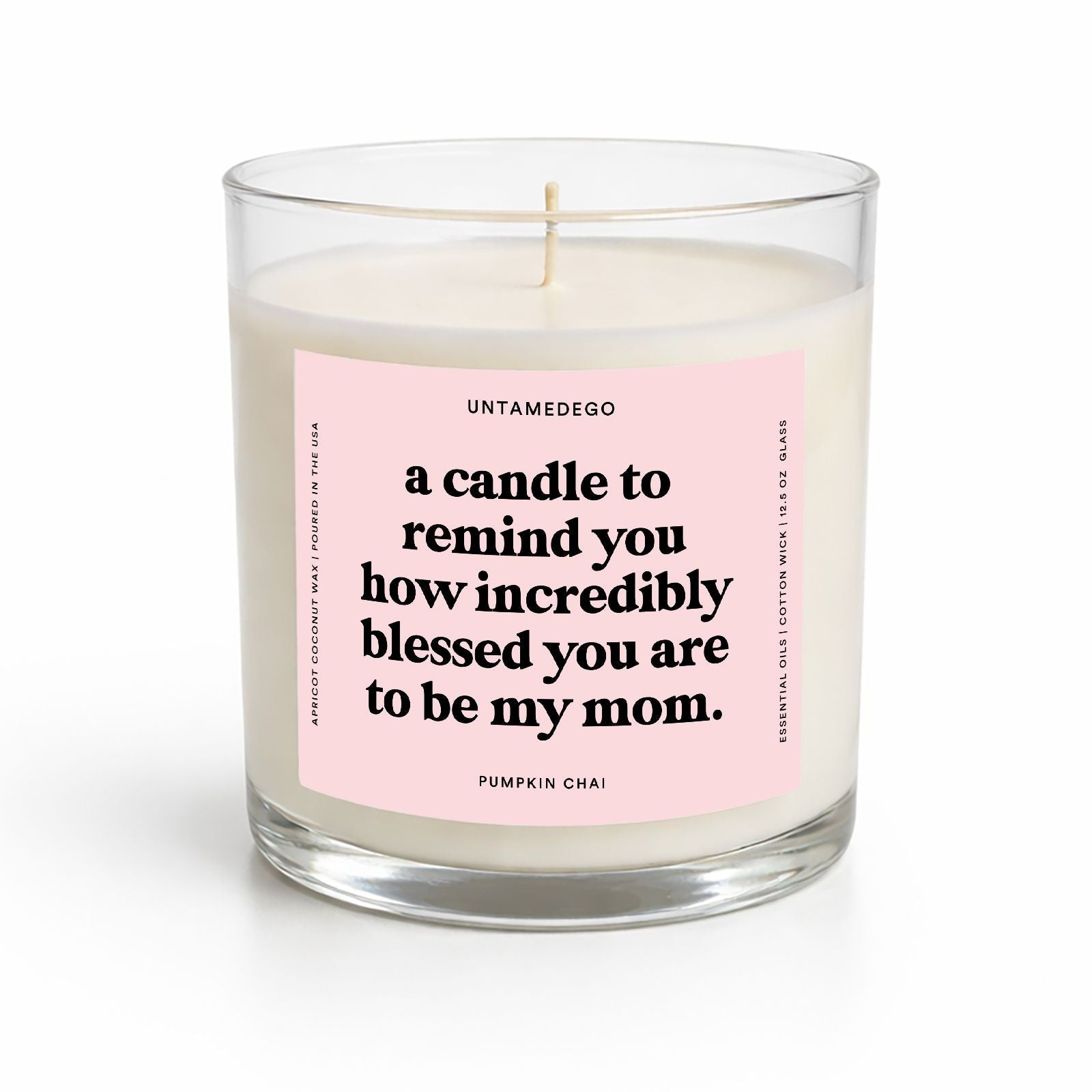 Candle with a pink label on a white background