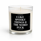 A clear glass jar candle with white wax and a black label featuring bold white text that reads, 'I LIKE SPOOKY THINGS & THE WORD FUCK.' The brand name 'UNTAMEDEGO' is visible at the top of the label, with 'PUMPKIN SPICE' at the bottom.