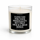 A clear glass jar candle with white wax and a black square label featuring bold white text that reads, 'I LOVE YOU FOR YOUR PERSONALITY BUT THAT DICK IS A HUGE BONUS.' The brand name 'UNTAMEDEGO' is visible at the top of the label.
