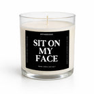 A clear glass jar candle with white wax and a black front label reading 'SIT ON MY FACE' in large white text. The brand name 'UNTAMEDEOGO' appears above the main title.