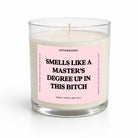 A white wax candle in a clear glass jar with a light pink label that reads 'SMELLS LIKE A MASTER'S DEGREE UP IN THIS BITCH' in bold black text. The brand name 'UNTAMEDEGO' is visible at the top of the label.