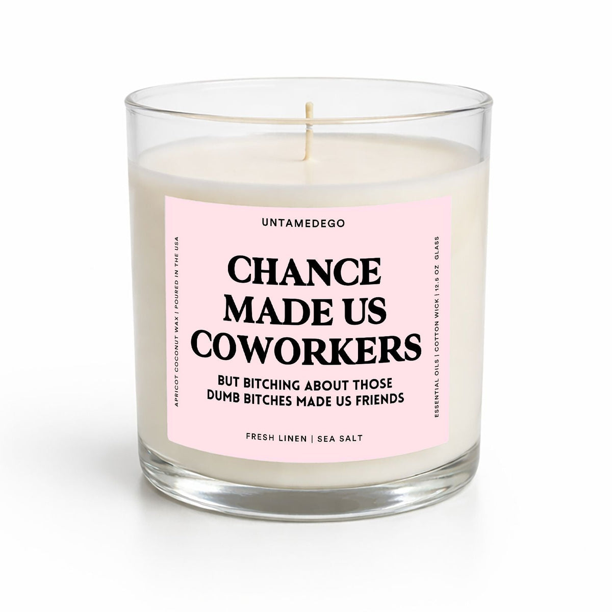 A glass jar candle with white wax and a pink label reading 'CHANCE MADE US COWORKERS' by UNTAMED GO, shown on a clean white background.