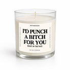 A sea salt and orchid scented candle in a clear glass jar with a white label that reads 'I'D PUNCH A BITCH FOR YOU RIGHT IN THE FACE' by Untamedigo.