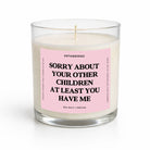 Candle with a pink label and text on a white background