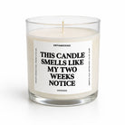 A clear glass jar candle with white wax and a single wick, featuring a white label with bold black text that reads 'THIS CANDLE SMELLS LIKE MY TWO WEEKS NOTICE' and the brand name 'UNTAMEDEGO' above. The candle is photographed on a clean white background.