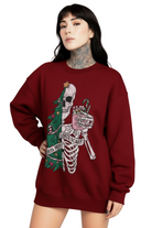 Person wearing a red sweatshirt with a graphic design on a white background