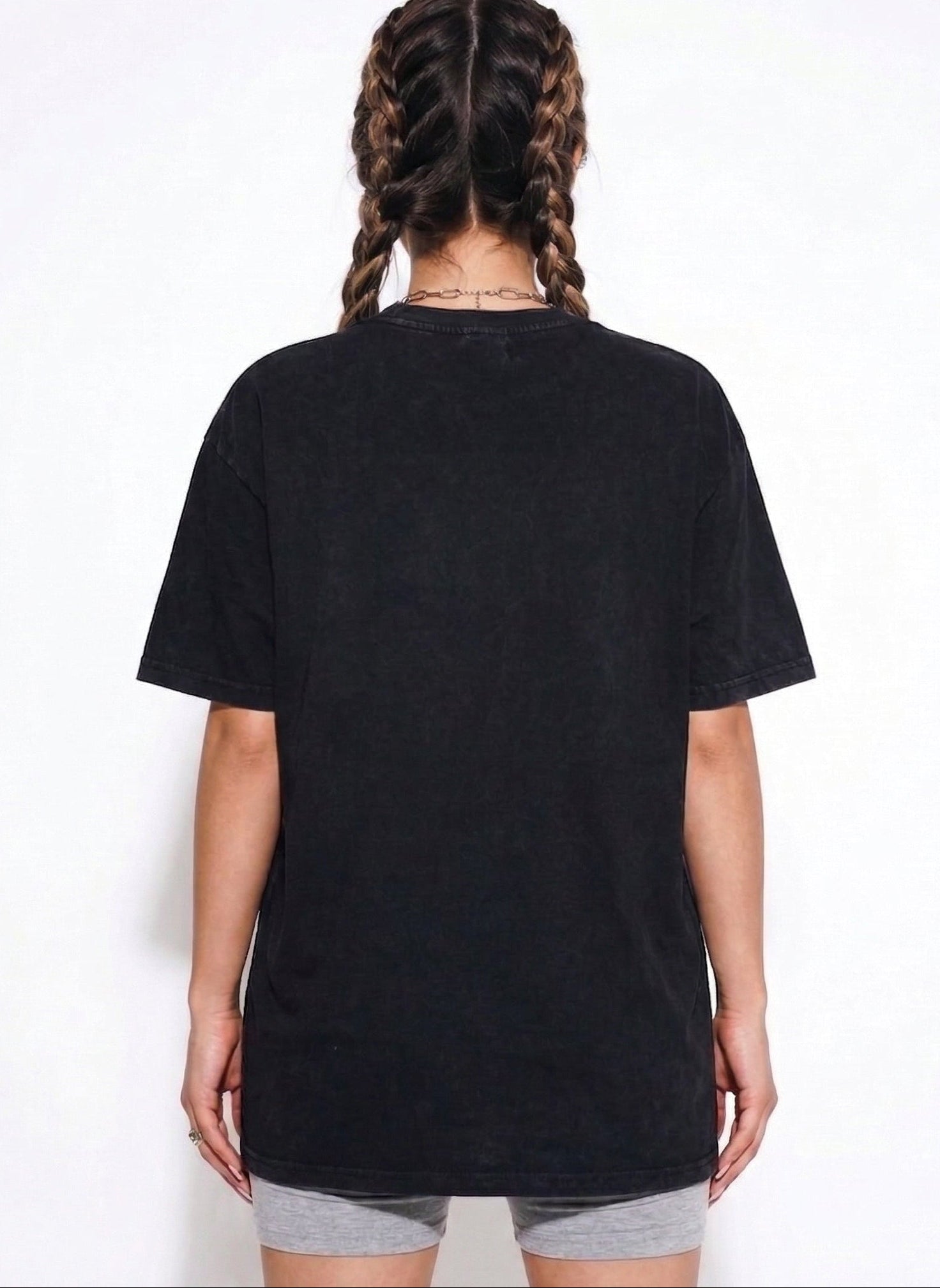 Person wearing a black t-shirt on a white background