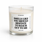 A glass jar candle with cream-colored wax and a white label featuring bold black text that reads 'SMELLS LIKE YOU SHOULD HESITATE TO REACH OUT TO ME' by Untamedogo, Vanilla Bean.