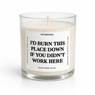 A clear glass jar candle with cream-colored wax and a white label featuring bold black text that reads, 'I'D BURN THIS PLACE DOWN IF YOU DIDN'T WORK HERE.' The brand name 'UNTAMEDEGO' is visible at the top of the label.