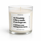 A clear glass jar candle with cream-colored wax and a white label featuring black text. The label reads 'UNTAMEDEGO' and 'my friendship is like a candle, if you forget me, I will burn your fucking house down.