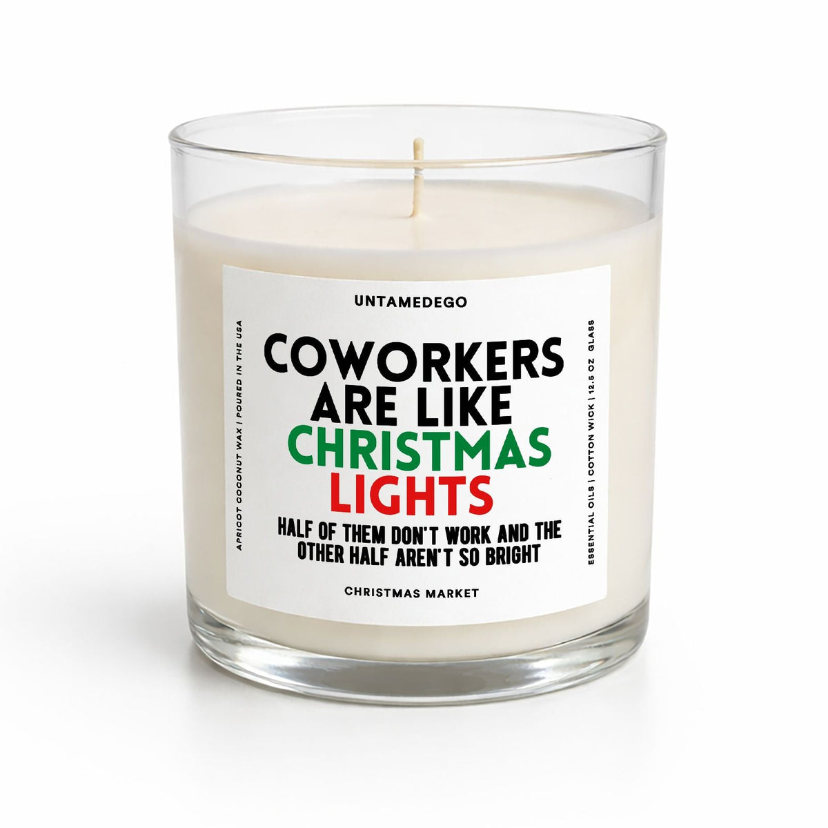 A glass jar candle with cream-colored wax and a white label featuring the text 'COWORKERS ARE LIKE CHRISTMAS LIGHTS' in black, green, and red. The brand name 'UNTAMEDEGO' is visible at the top of the label.