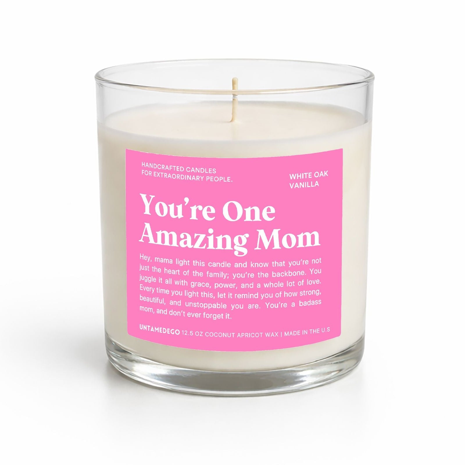 Candle with a pink label reading 'You're One Amazing Mom' on a white background