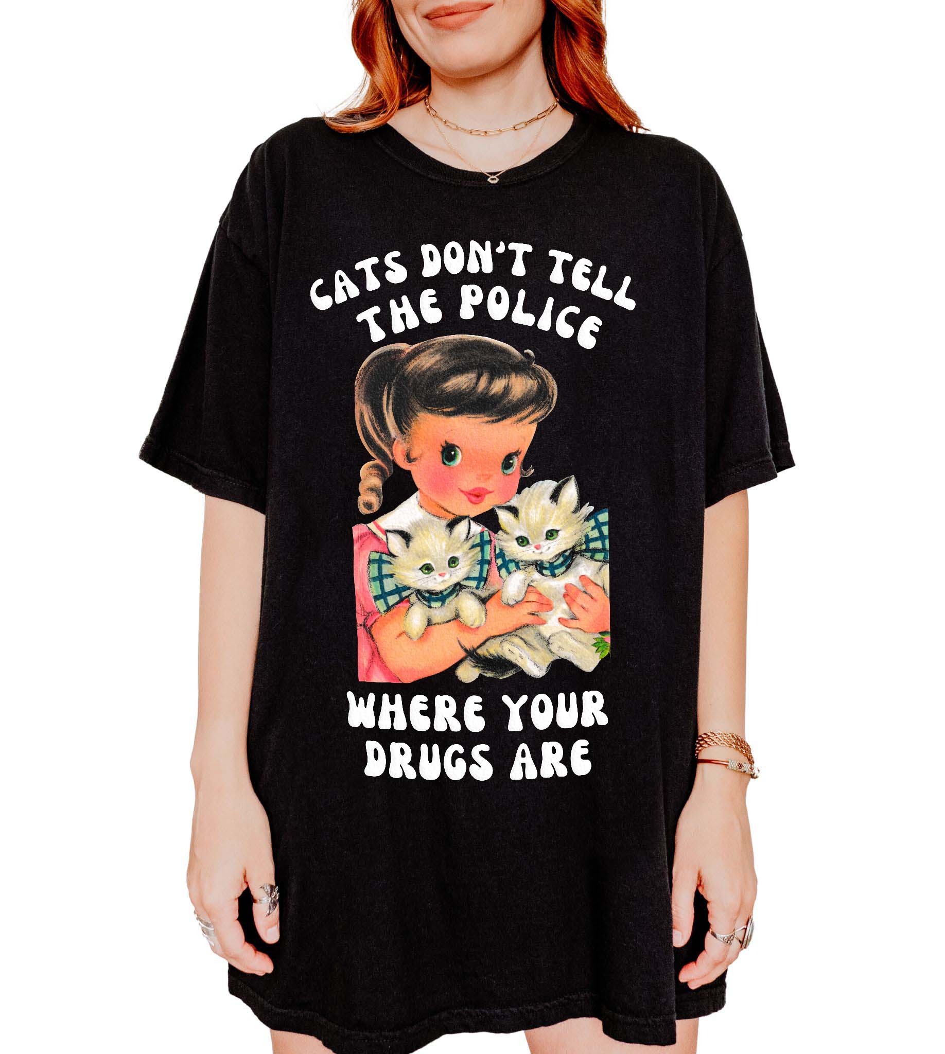 Funny graphic t-shirt with vintage cat illustration and bold humorous text about cats not telling the police