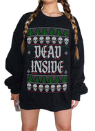 A person wearing a black crewneck sweatshirt with a festive Christmas-themed graphic that reads 'Y'ALL SERIOUSLY NEED TRAINING' in white text, flanked by red gift boxes, with snowflake and pine tree patterns at the top and bottom.