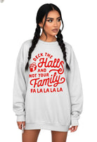 Woman wearing a gray sweatshirt with red text on a white background