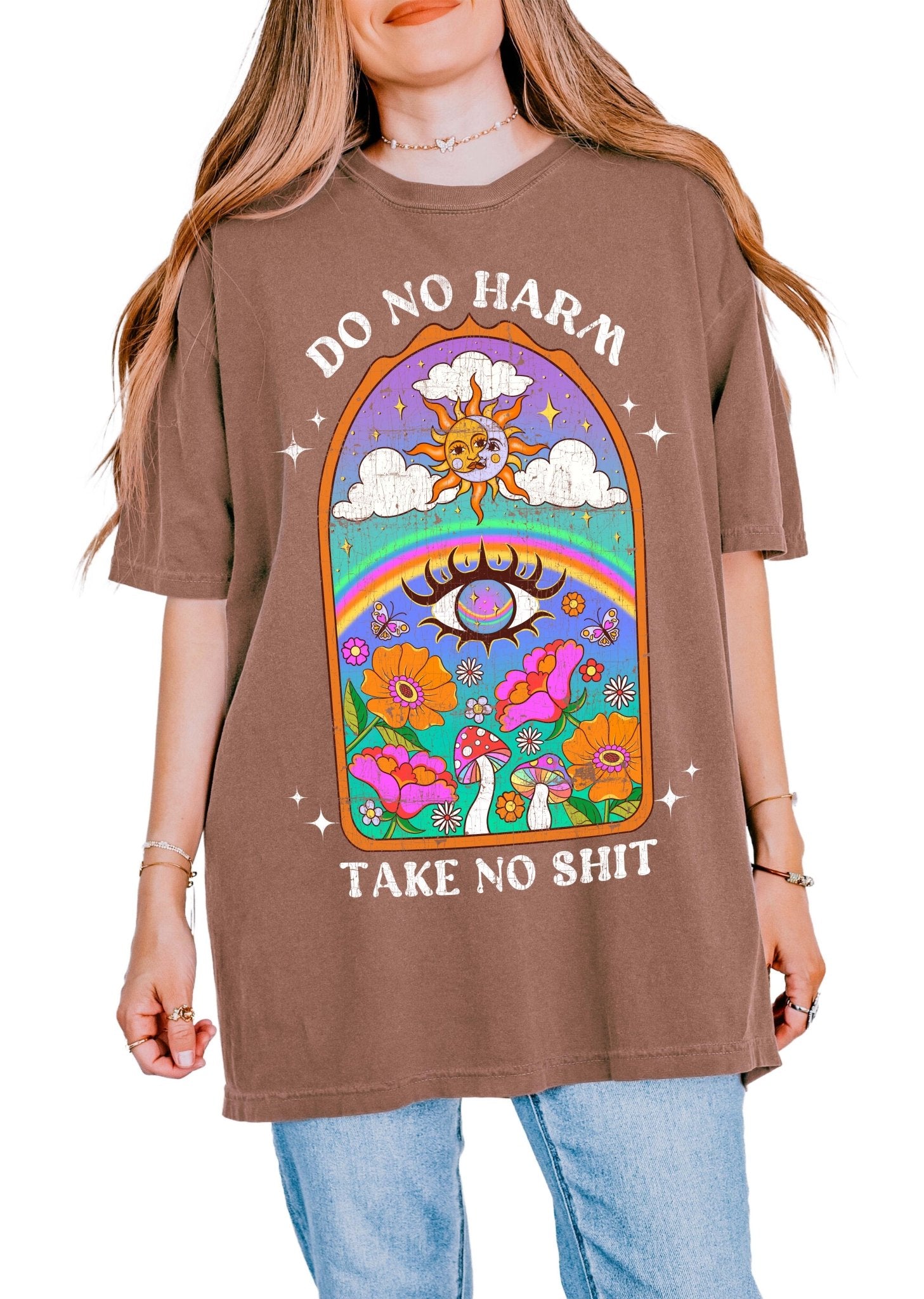 Spiritual graphic t-shirt with sun, rainbow, flowers, and text saying do no harm take no shit