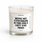 A clear glass jar candle with cream-colored wax and a single wick, featuring a white label with bold black text that reads 'BEING MY COWORKER IS THE ONLY GIFT YOU NEED.' The brand name 'UNTAMEDEGO' is visible at the top of the label.