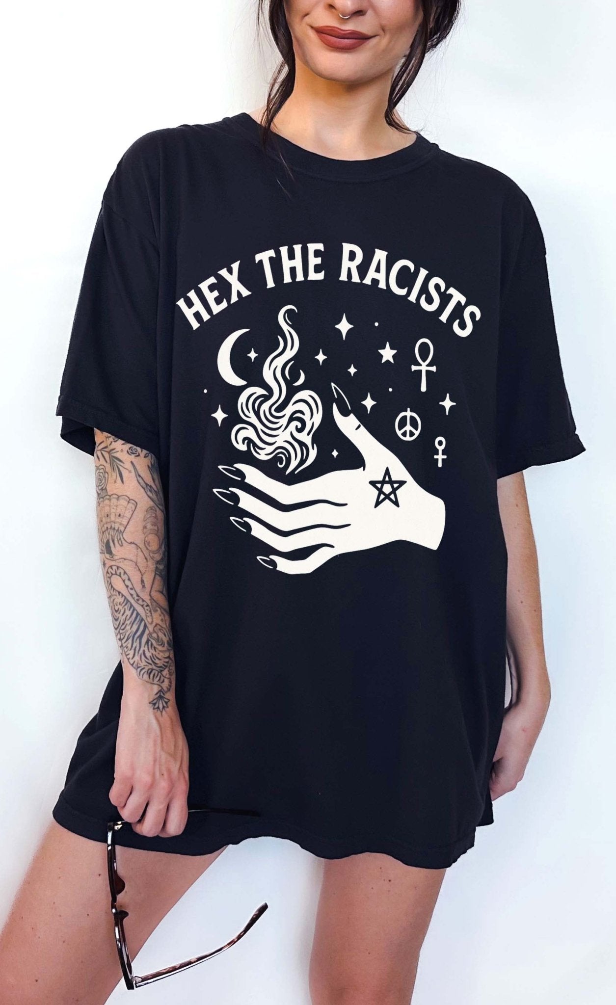Witchy graphic t-shirt with occult symbols and bold text reading hex the racists