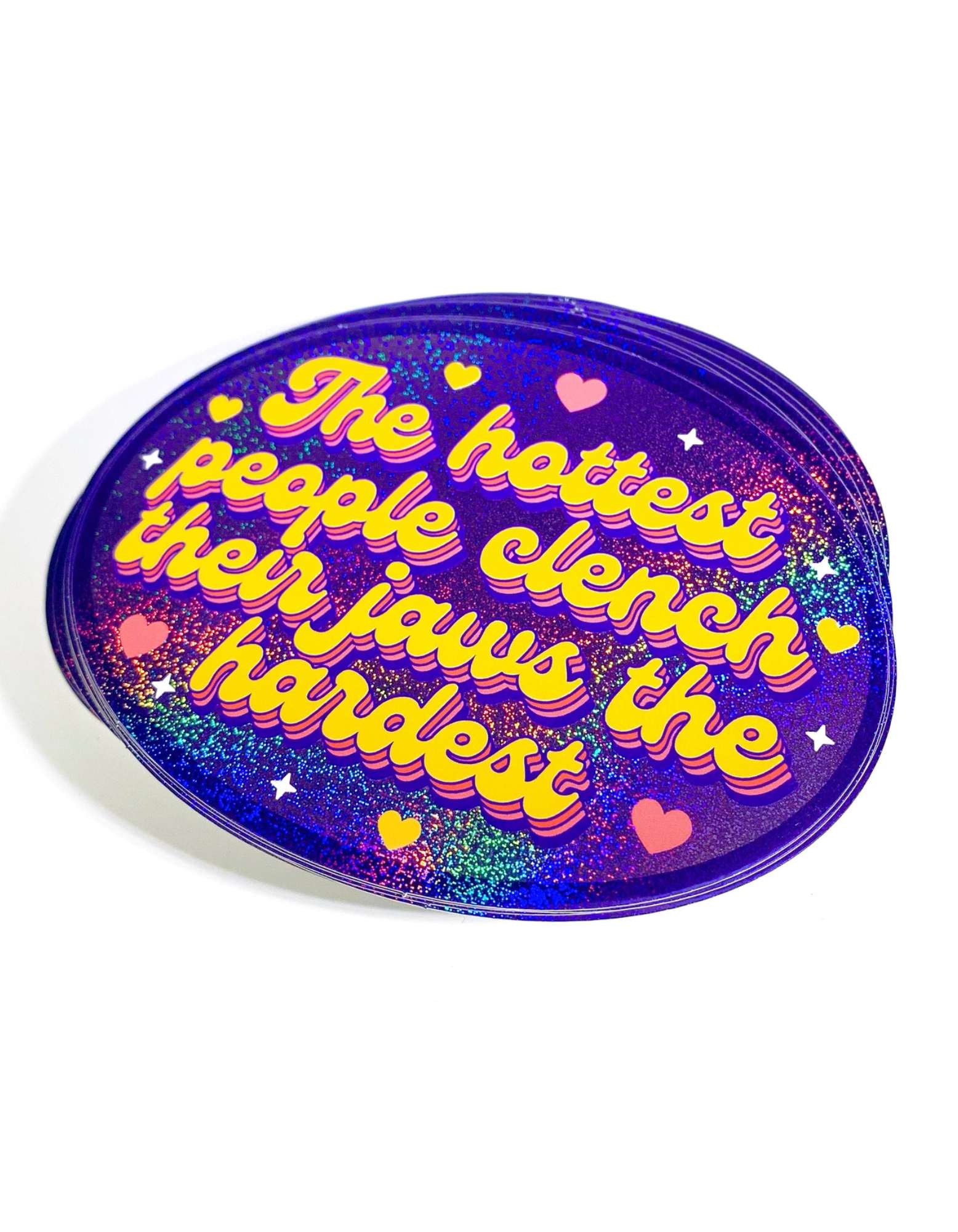 “4.5×3.3 inch holographic glitter vinyl sticker reading ‘The hottest people clench their jaws the hardest’”