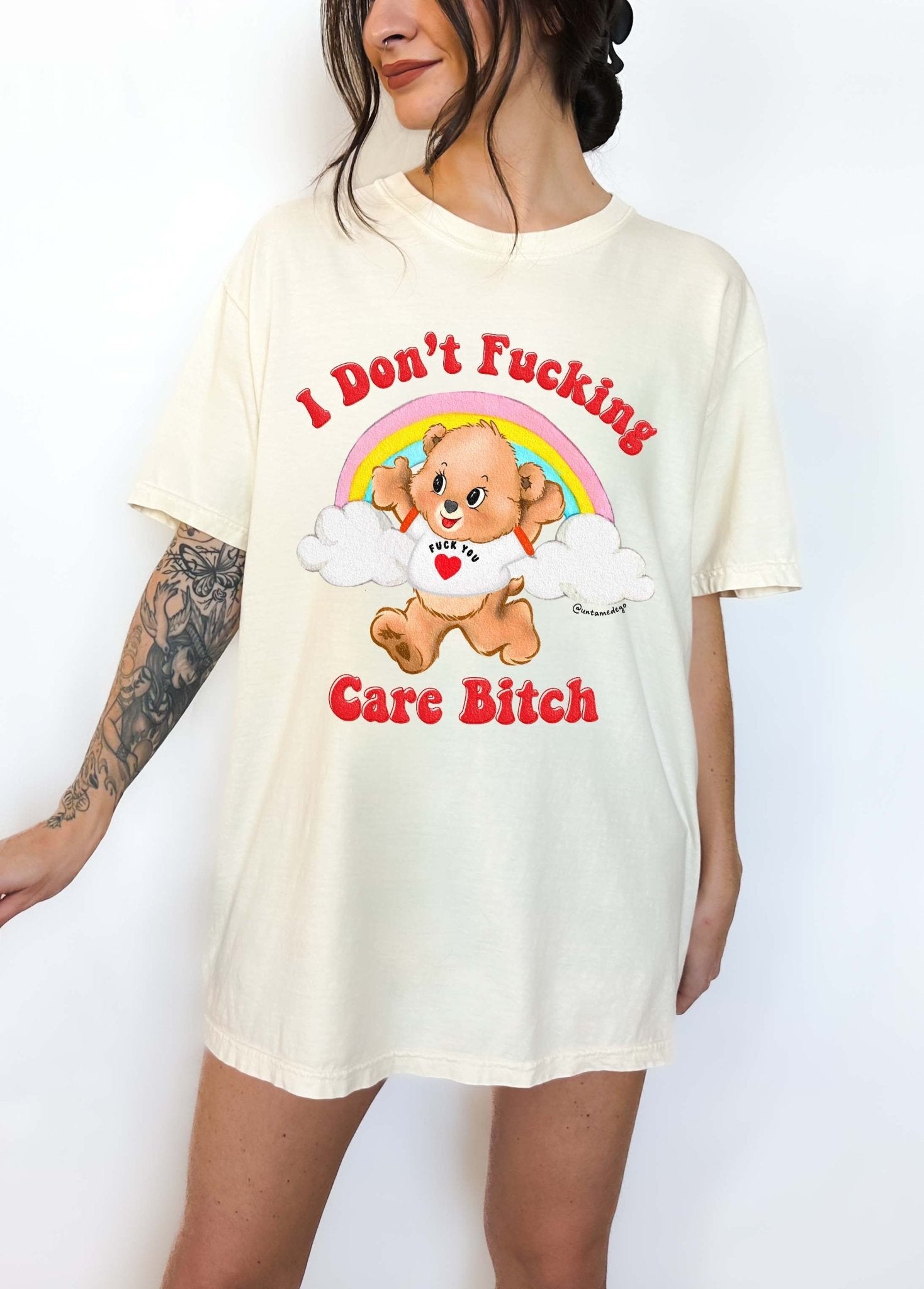 Funny graphic t-shirt with cute bear and rainbow design and bold text expressing not caring attitude