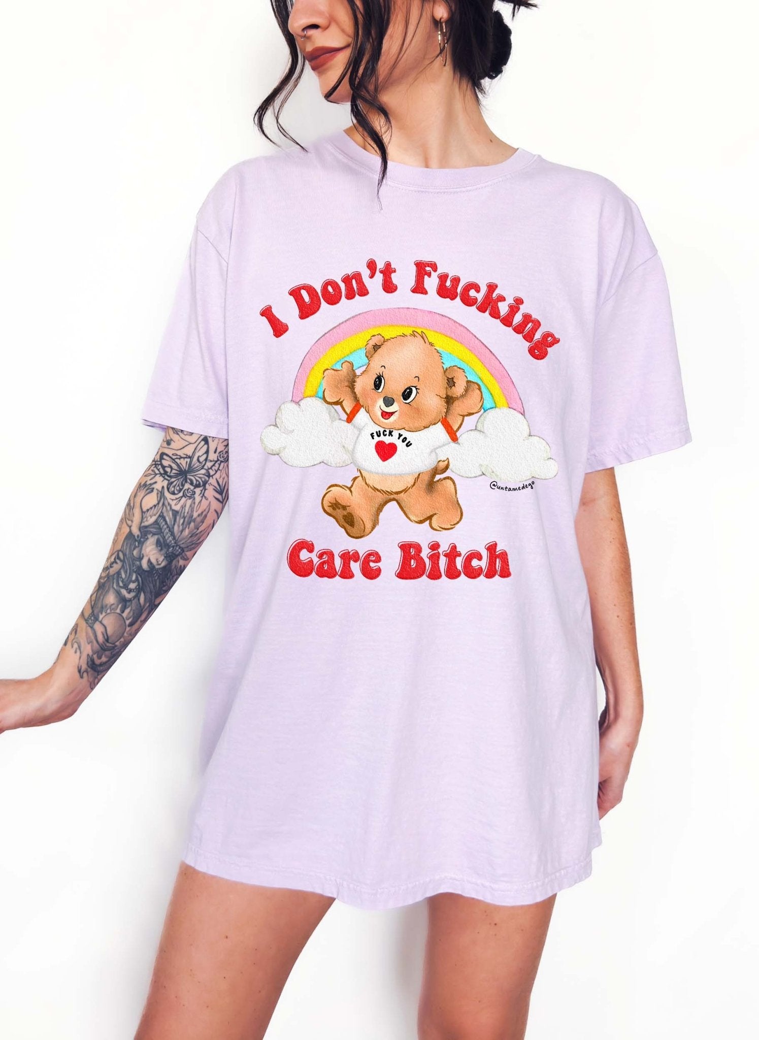 Funny graphic t-shirt with cute bear and rainbow design and bold text expressing not caring attitude