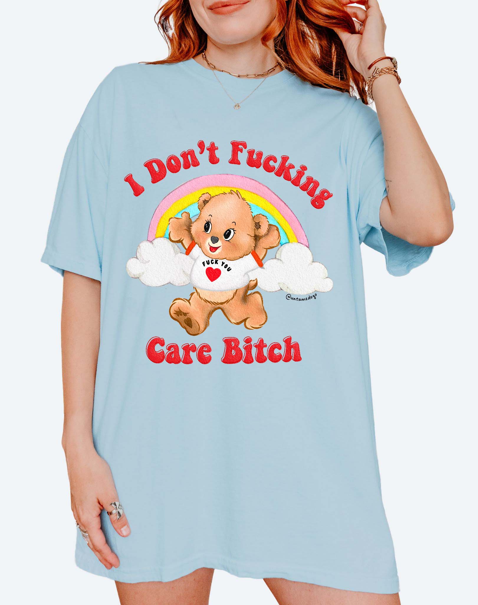 Funny graphic t-shirt with cute bear and rainbow design and bold text expressing not caring attitude