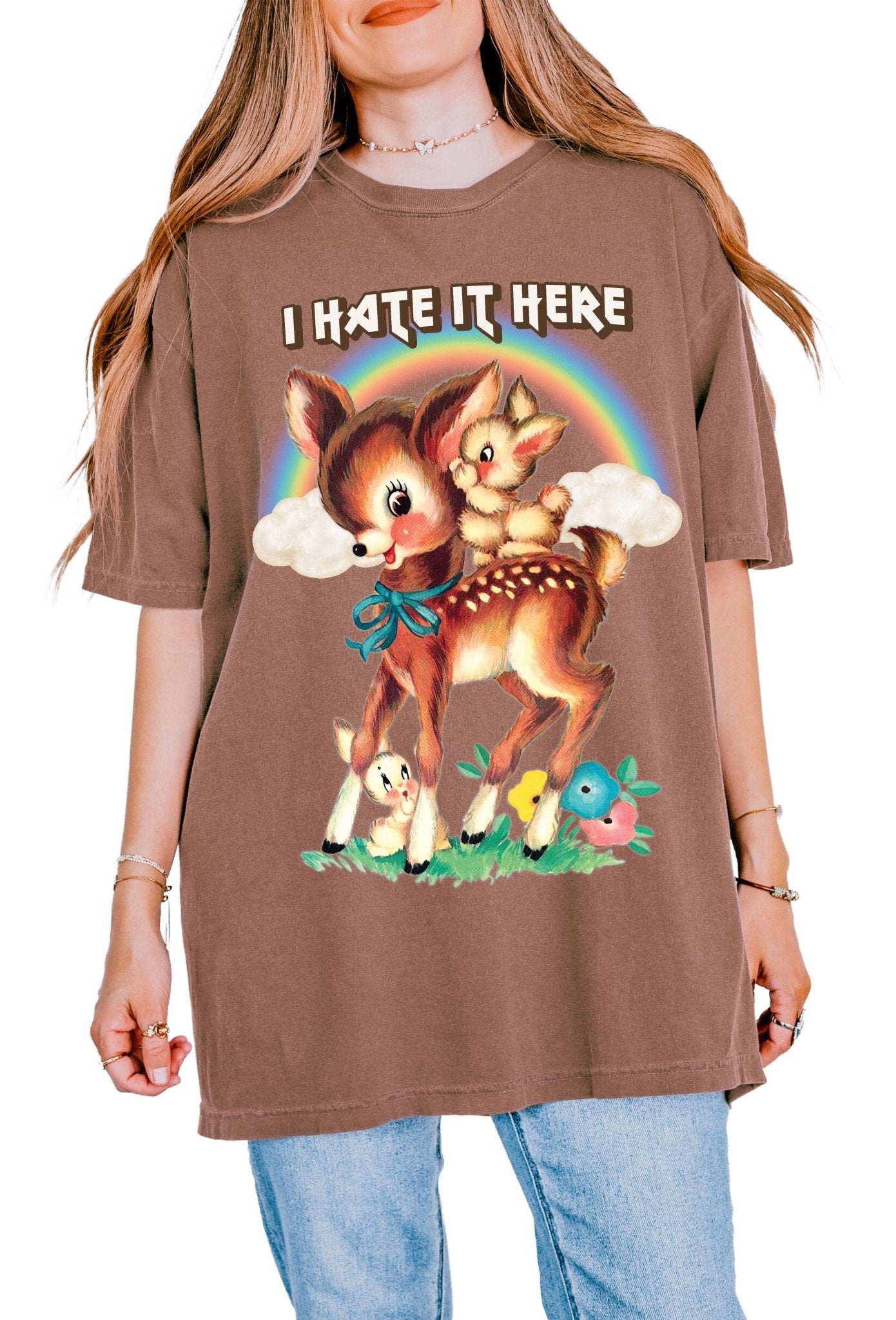Funny graphic t-shirt with cute deer illustration and text saying I hate it here