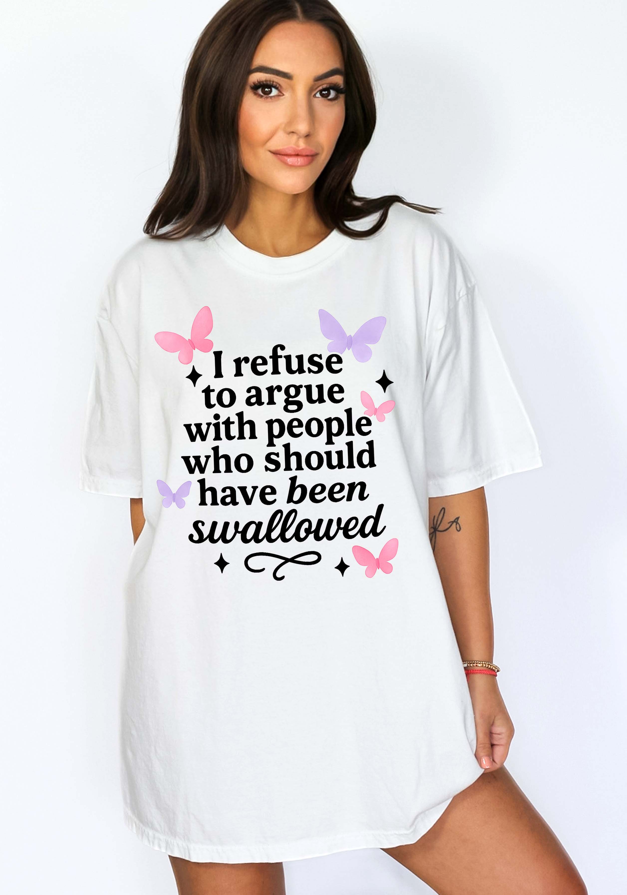 Woman wearing a white t-shirt with a humorous text design on a plain background