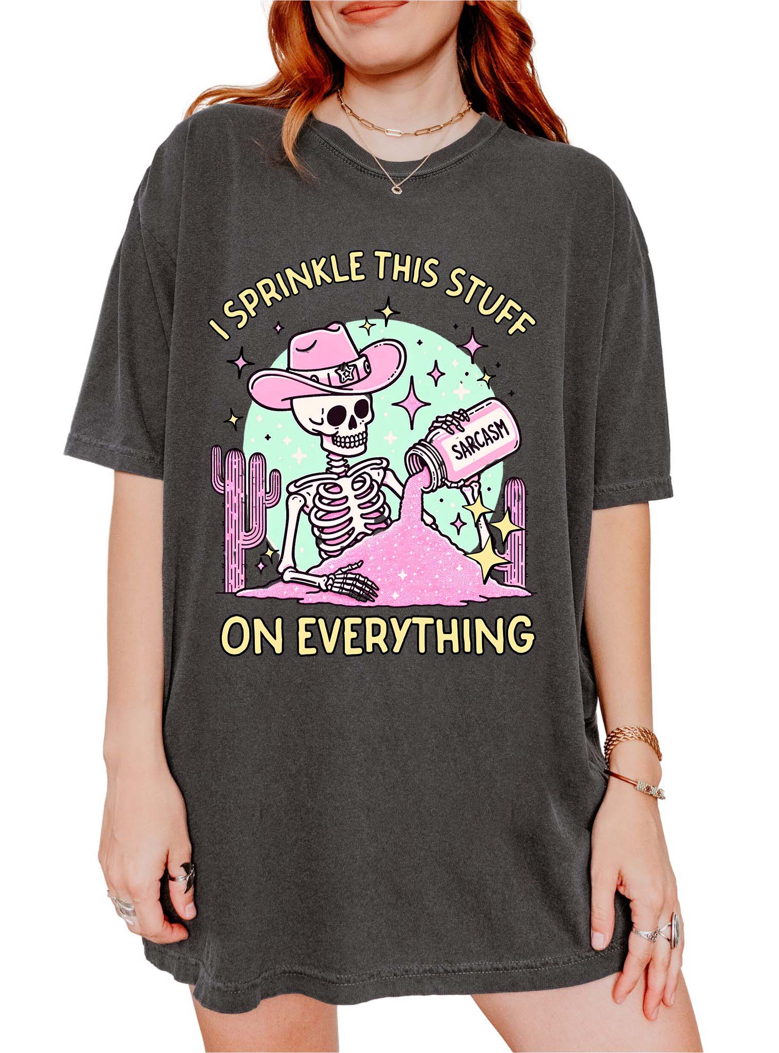 Funny graphic t-shirt with skeleton sprinkling sarcasm and text saying I sprinkle this stuff on everything