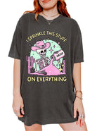 Funny graphic t-shirt with skeleton sprinkling sarcasm and text saying I sprinkle this stuff on everything
