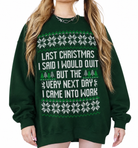 A woman wearing a dark green crewneck sweatshirt with a white and green Christmas-themed graphic that reads, 'LAST CHRISTMAS I SAID I WOULD QUIT BUT THE VERY NEXT DAY I CAME INTO WORK'.