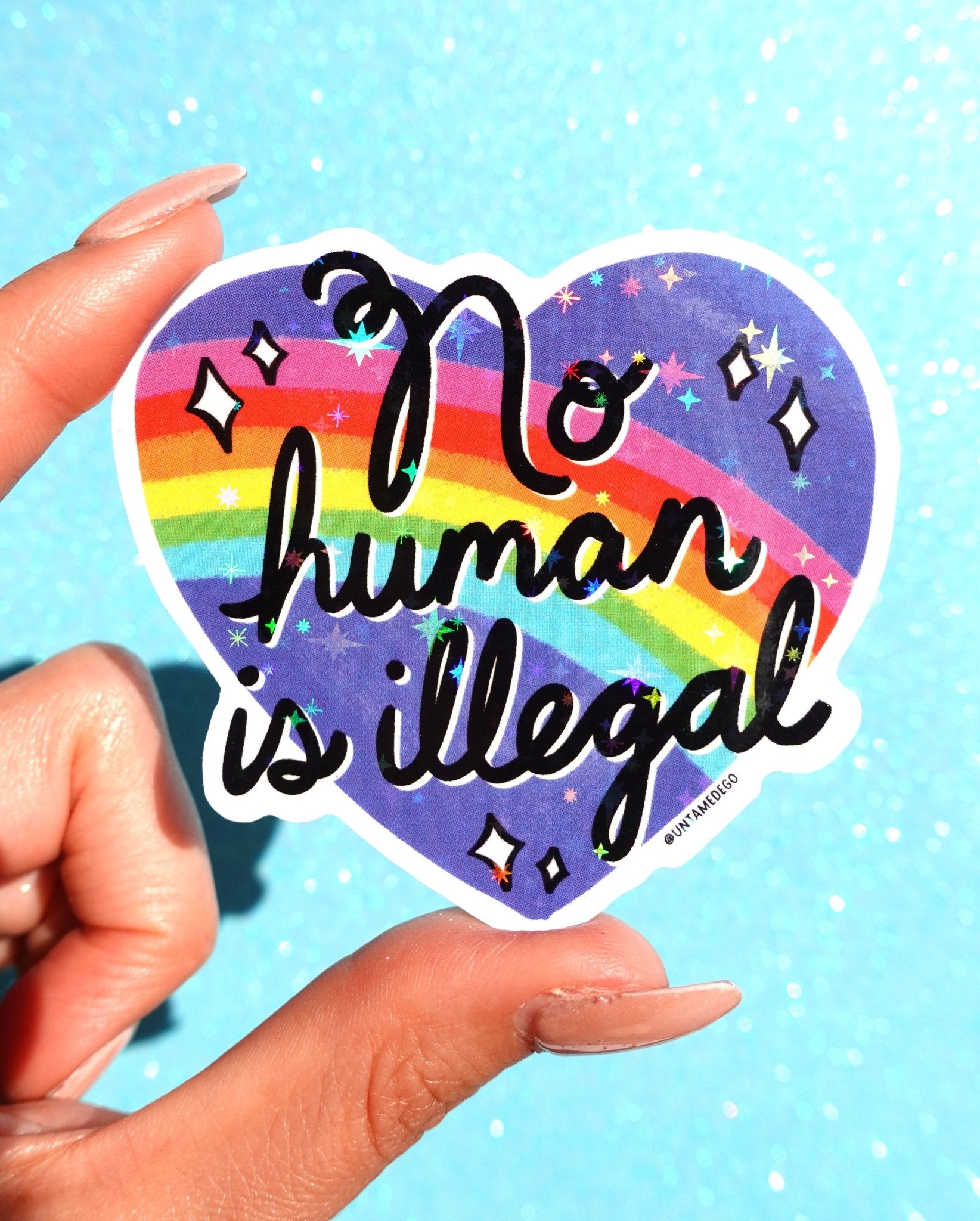 No Human Is Illegal Sticker – Rainbow Heart Holographic Vinyl Sticker - UntamedEgo LLC.
