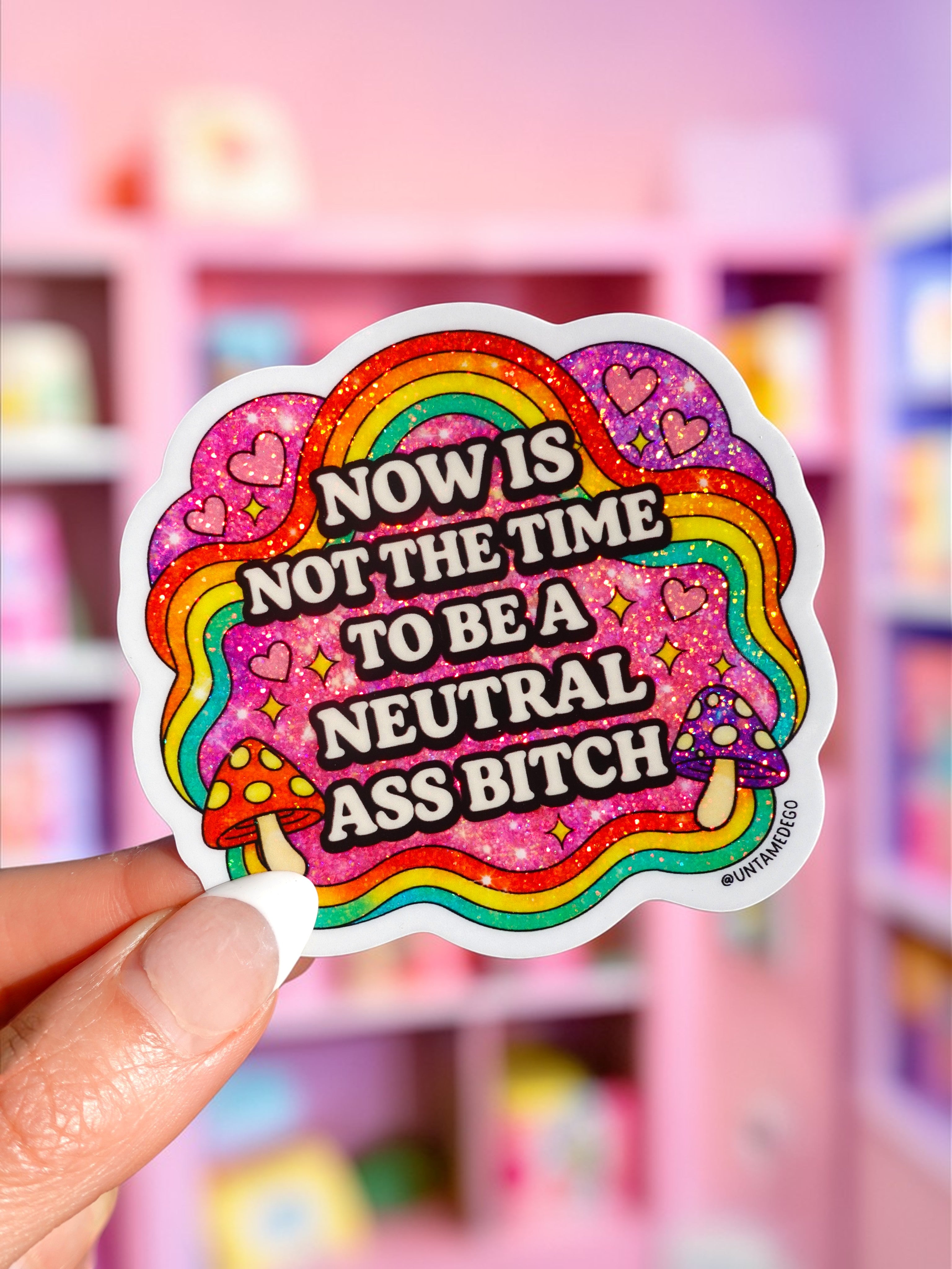 Colorful holographic rainbow vinyl sticker with bold political text and decorative elements