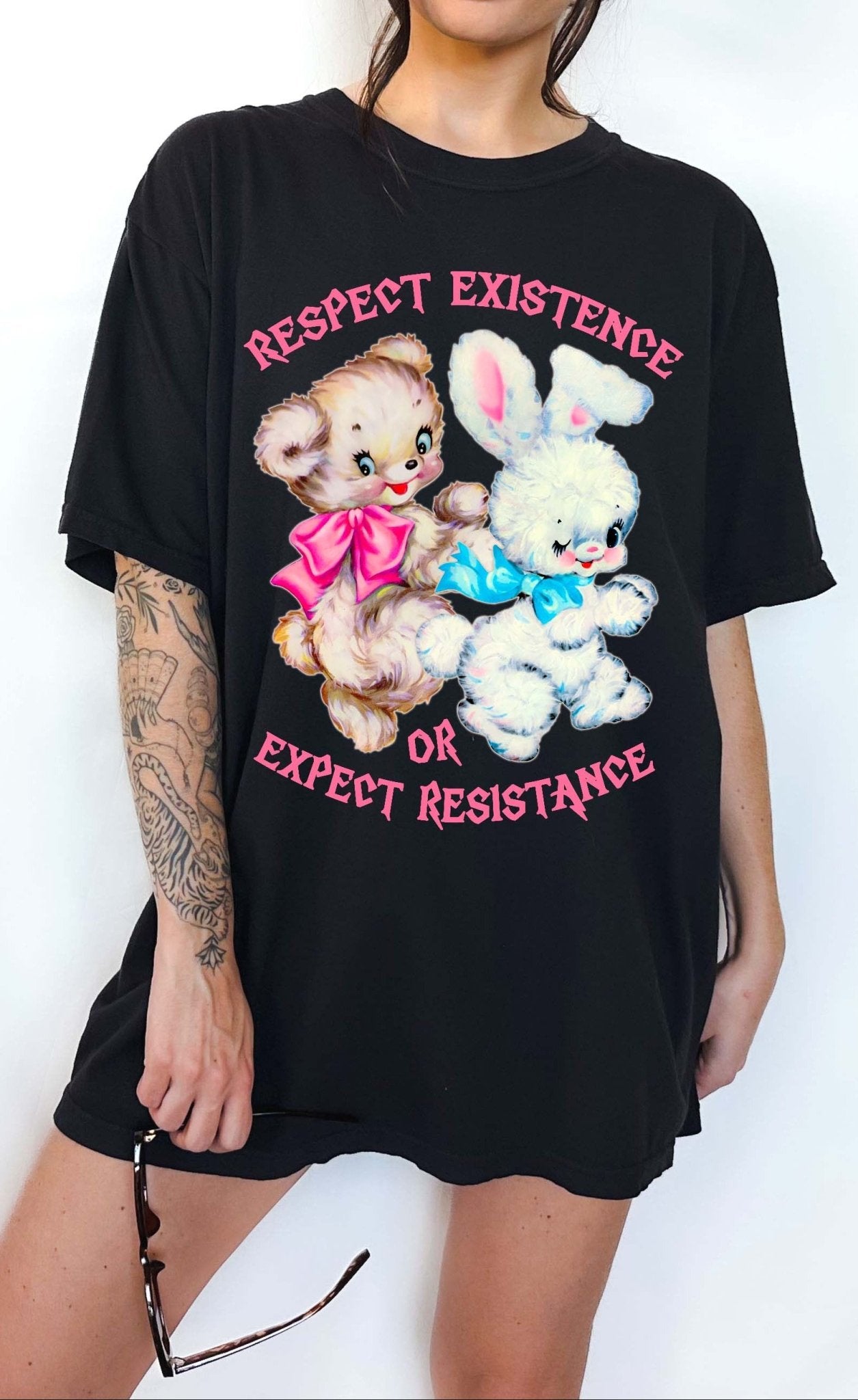 Protest graphic t-shirt with vintage teddy bear and bunny design and text saying respect existence or expect resistance