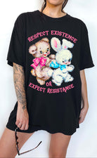 Protest graphic t-shirt with vintage teddy bear and bunny design and text saying respect existence or expect resistance