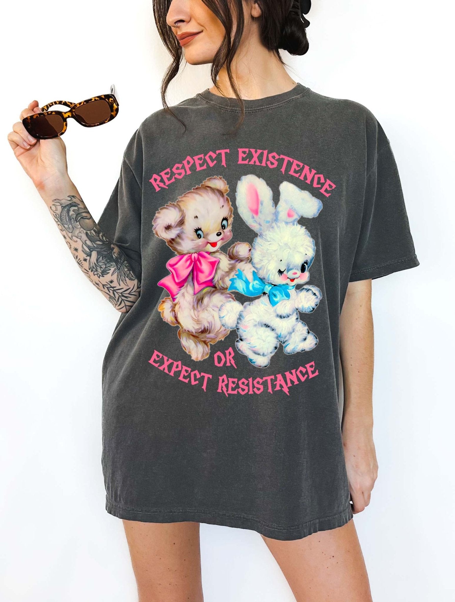 Protest graphic t-shirt with vintage teddy bear and bunny design and text saying respect existence or expect resistance